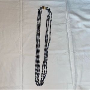 triple strand black pearl-like necklace